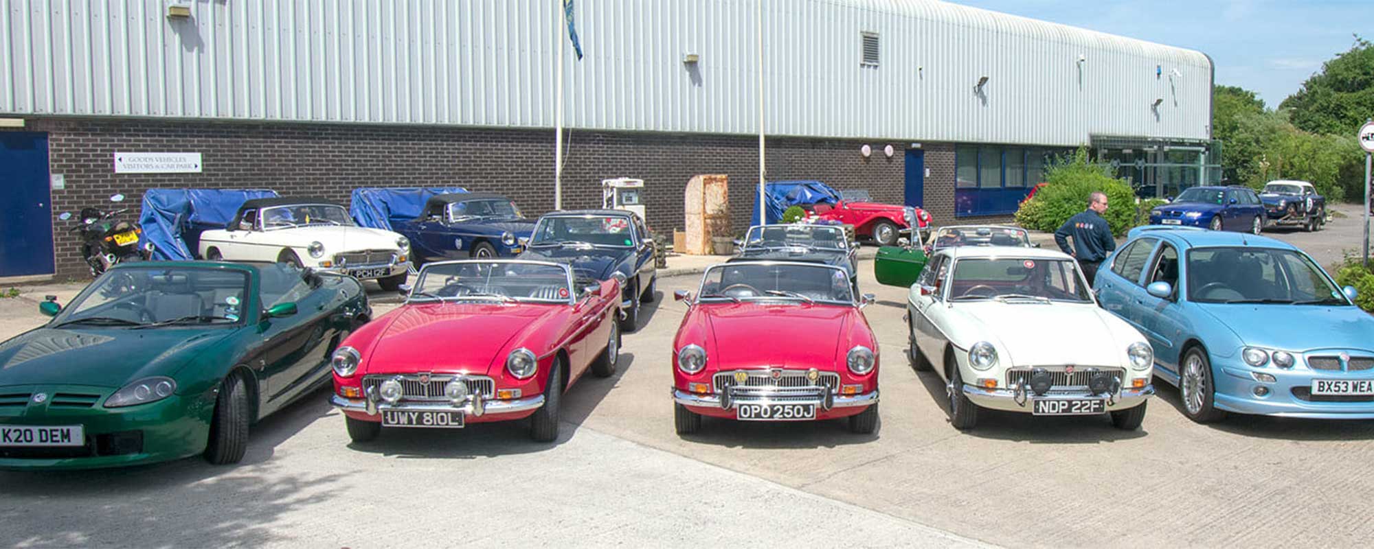 BMH factory with heritage cars outside
